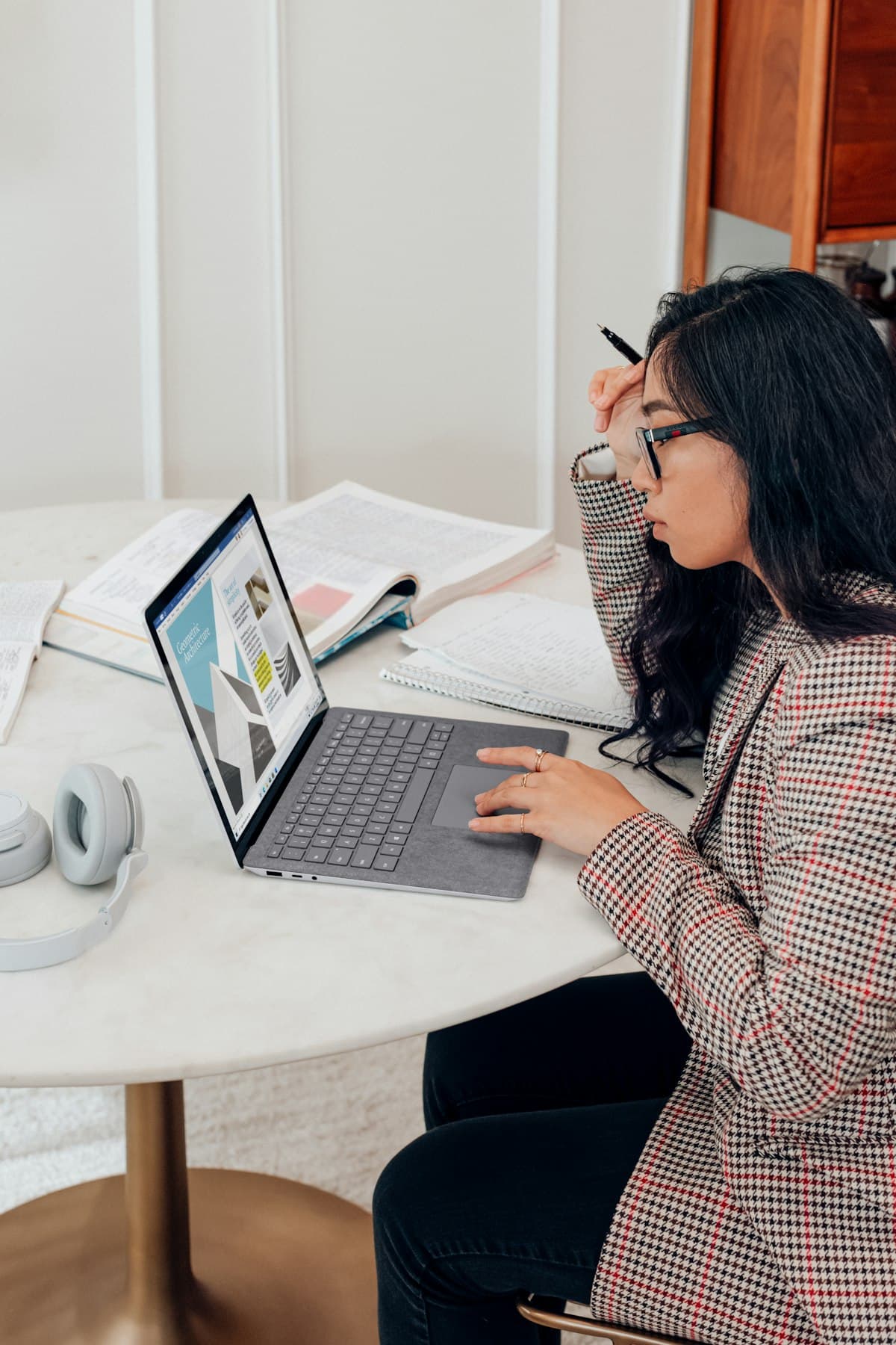 A woman at home getting legal advice on her laptop